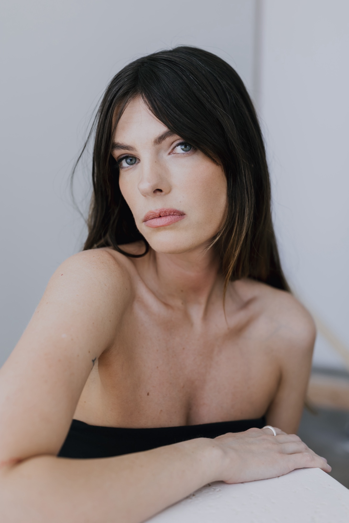 Editorial beauty portrait of a model with luminous, natural skin and softly defined eyes