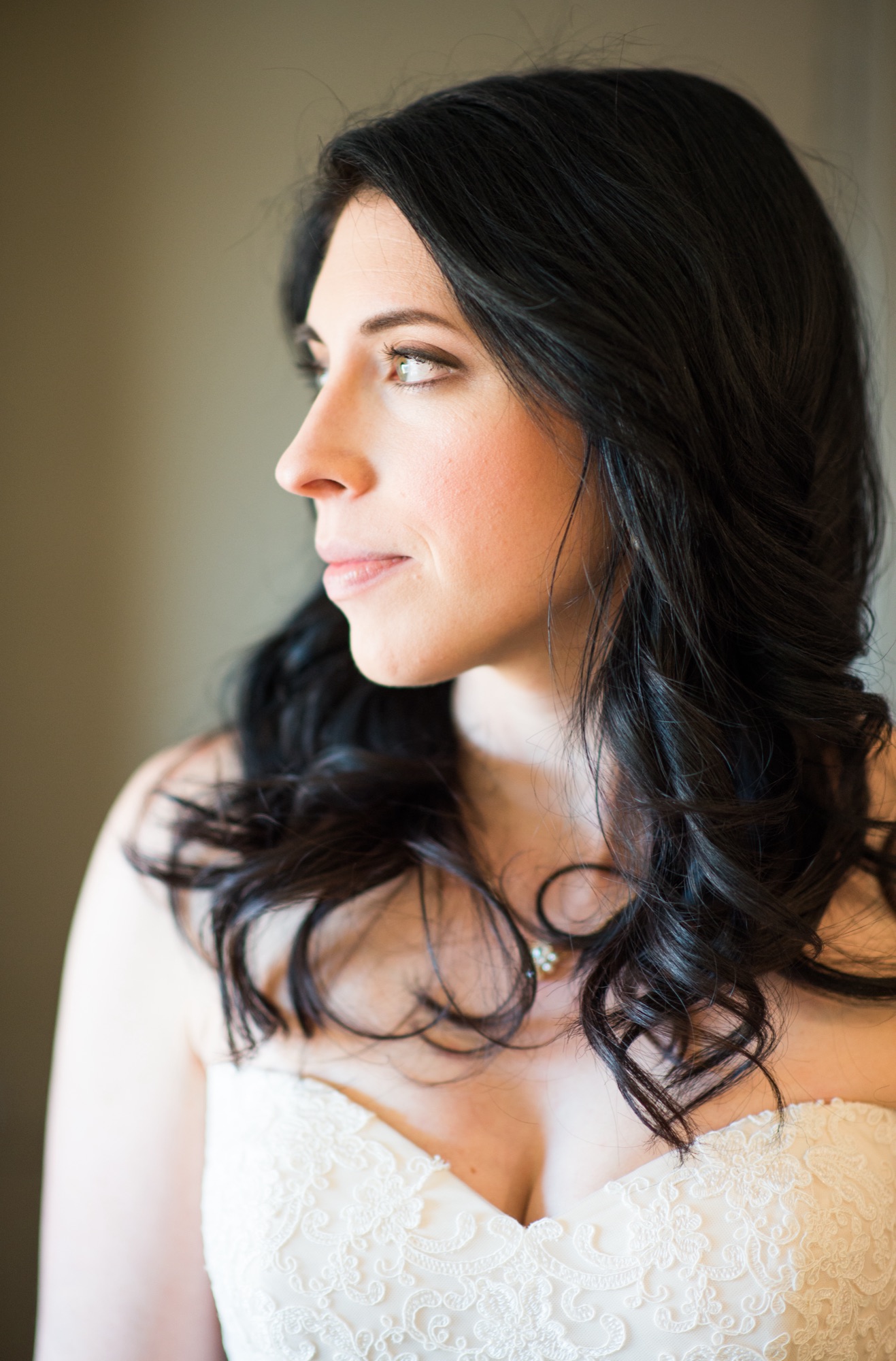 Profile portrait of a bride with luminous skin and softly defined eyes