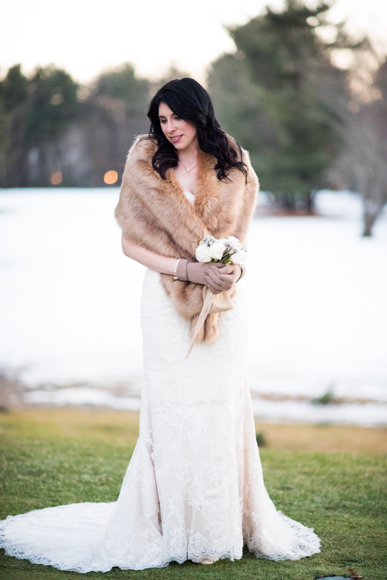Saratoga Springs bride in a fur stole on a snowy winter wedding day, glowing complexion